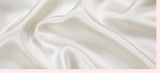 Chroma Chic: White Silk Pillowcase with Colorful Accents